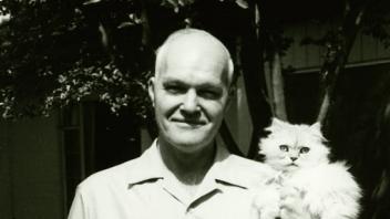 Prof. Bohart with Miss Bo the cat.